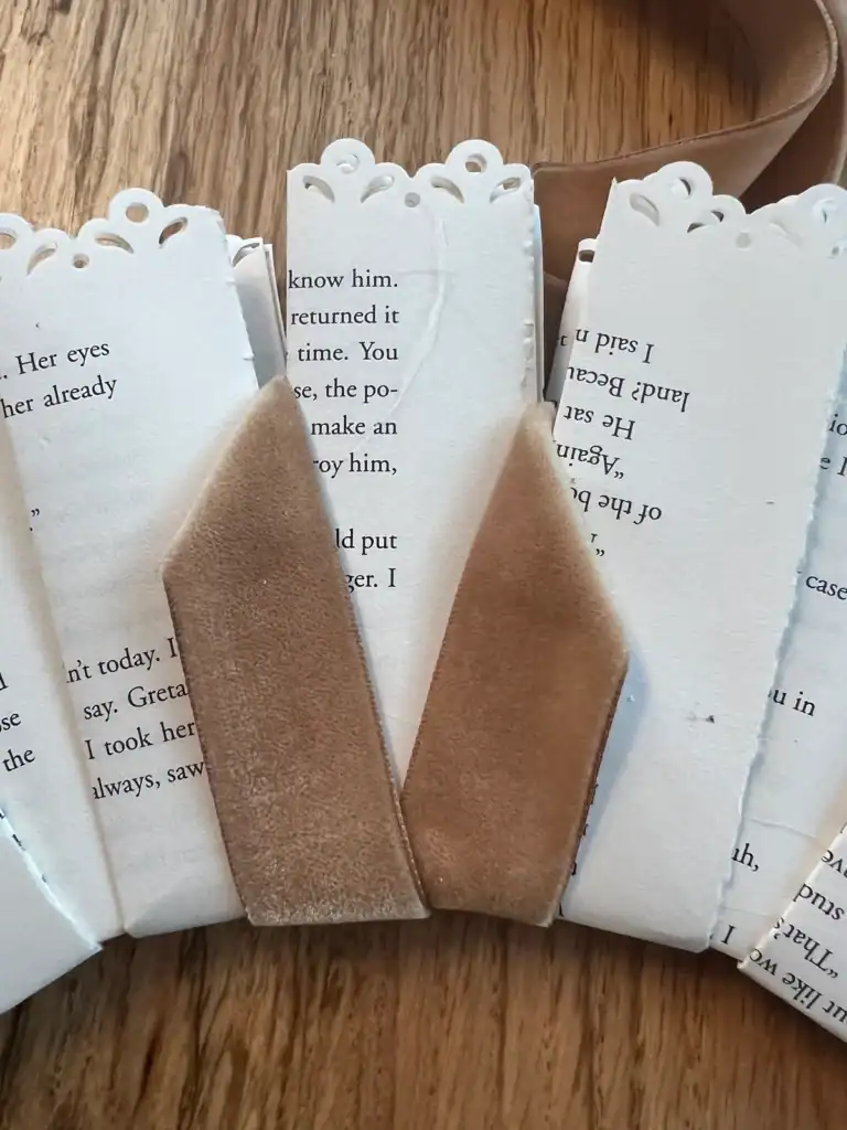 Adding velvet ribbon to a handmade book page wreath
