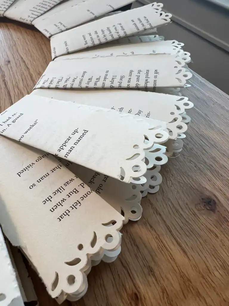 Curled decorative book page edges on a vintage paper wreath