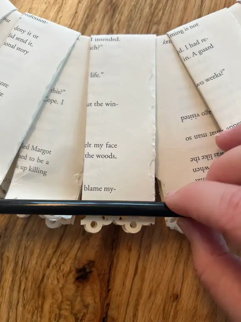 Curled decorative book page edges on a vintage paper wreath